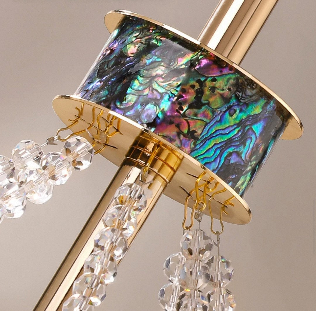 Modern flush-mount chandelier with abalone and crystal detailing.