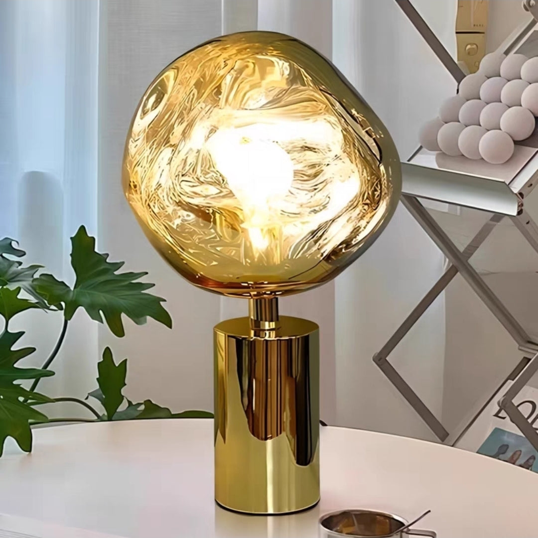 Close-up of molten glass globe lamp illuminating modern living space.