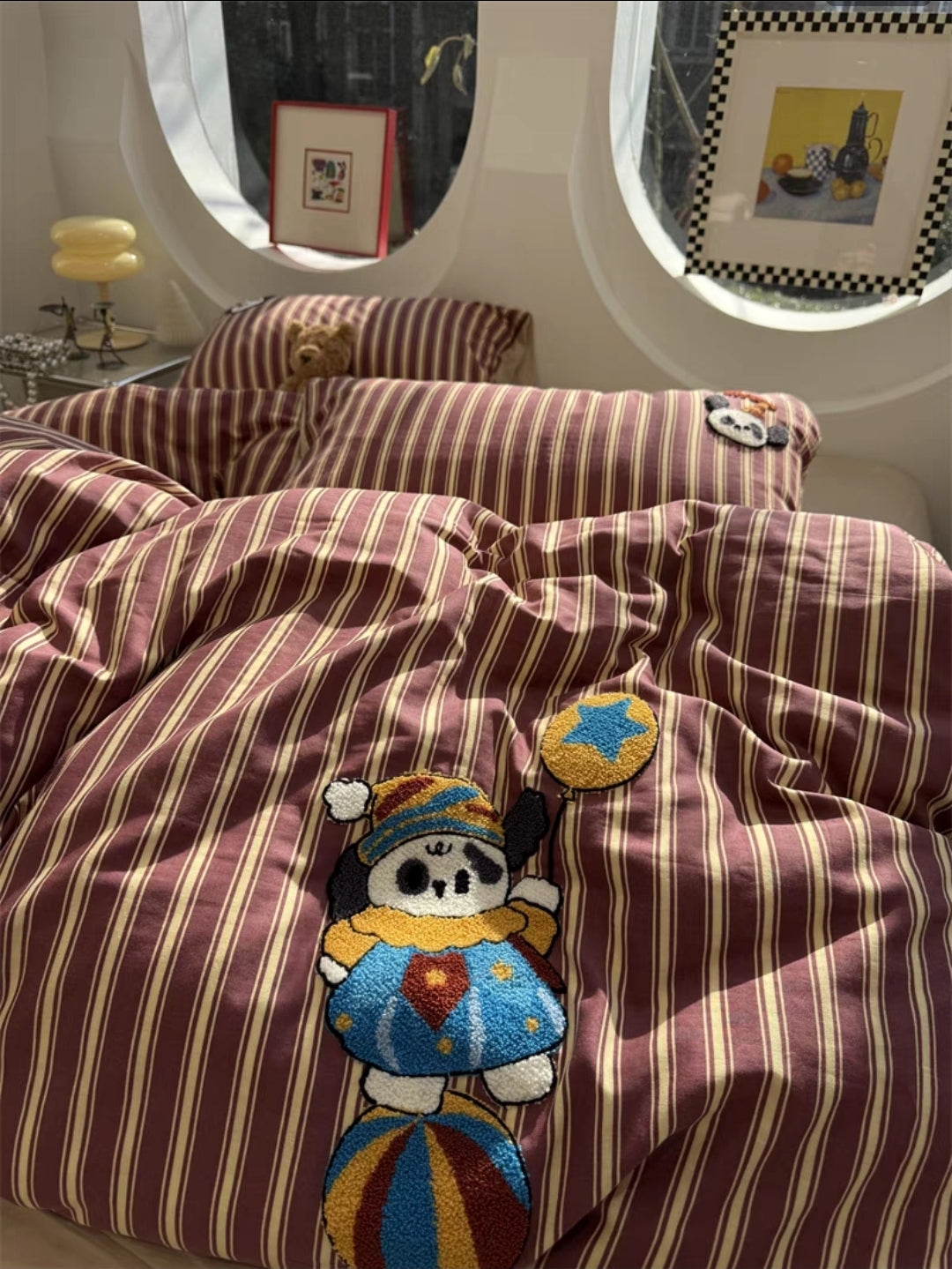 Striped cartoon bedding set with embroidered character in a room setting