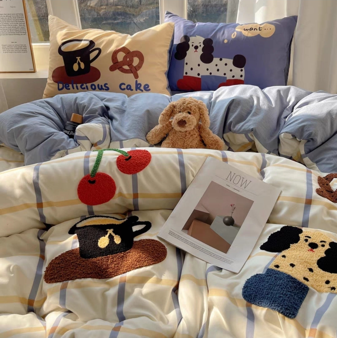 Children's bedding set with cartoon designs on a bed