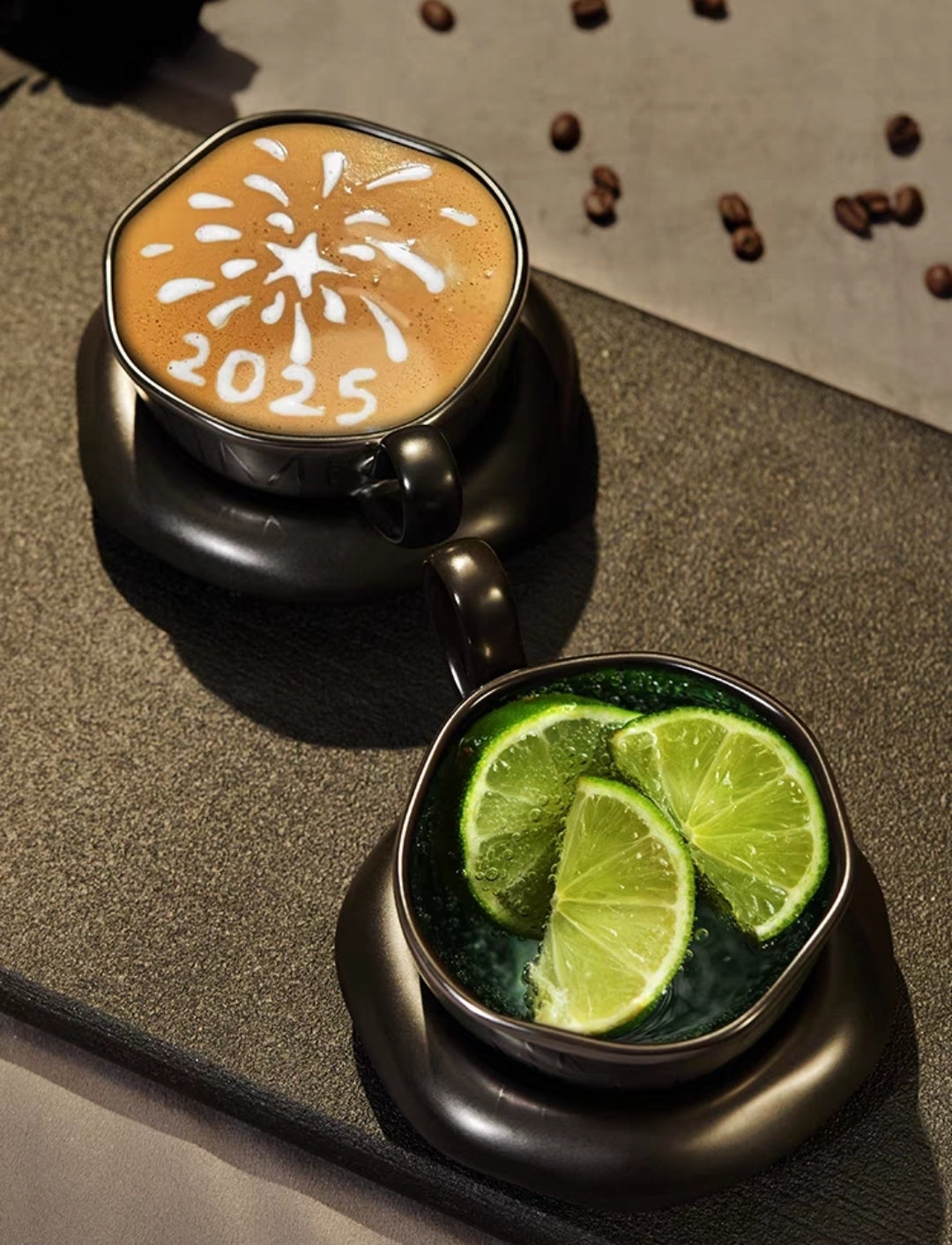 Two cups of coffee with decorative elements on a textured surface.