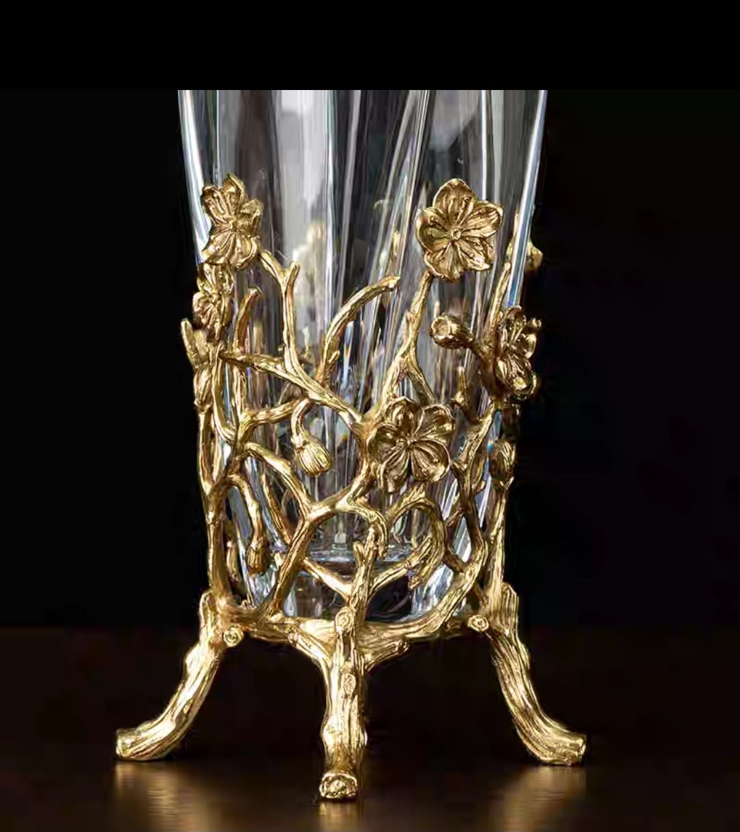 Close-Up of Hand-Carved Bronze Detailing on Crystal Vase Base