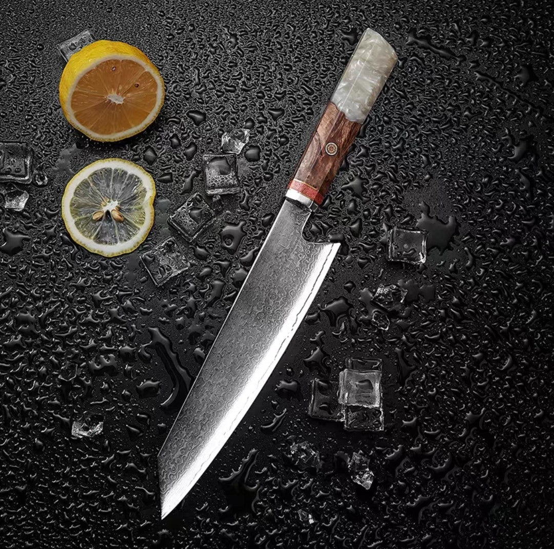 Cream resin wood handle Damascus steel knife on textured black backdrop