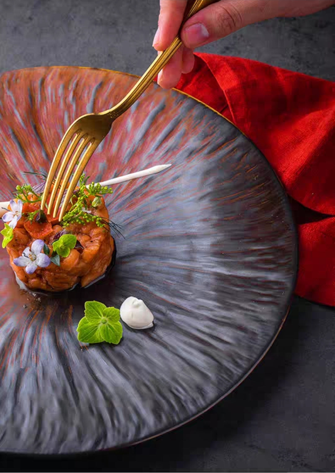 Chinese-style ceramic flat plate with glossy glaze and textured surface, styled with chopsticks and red napkin