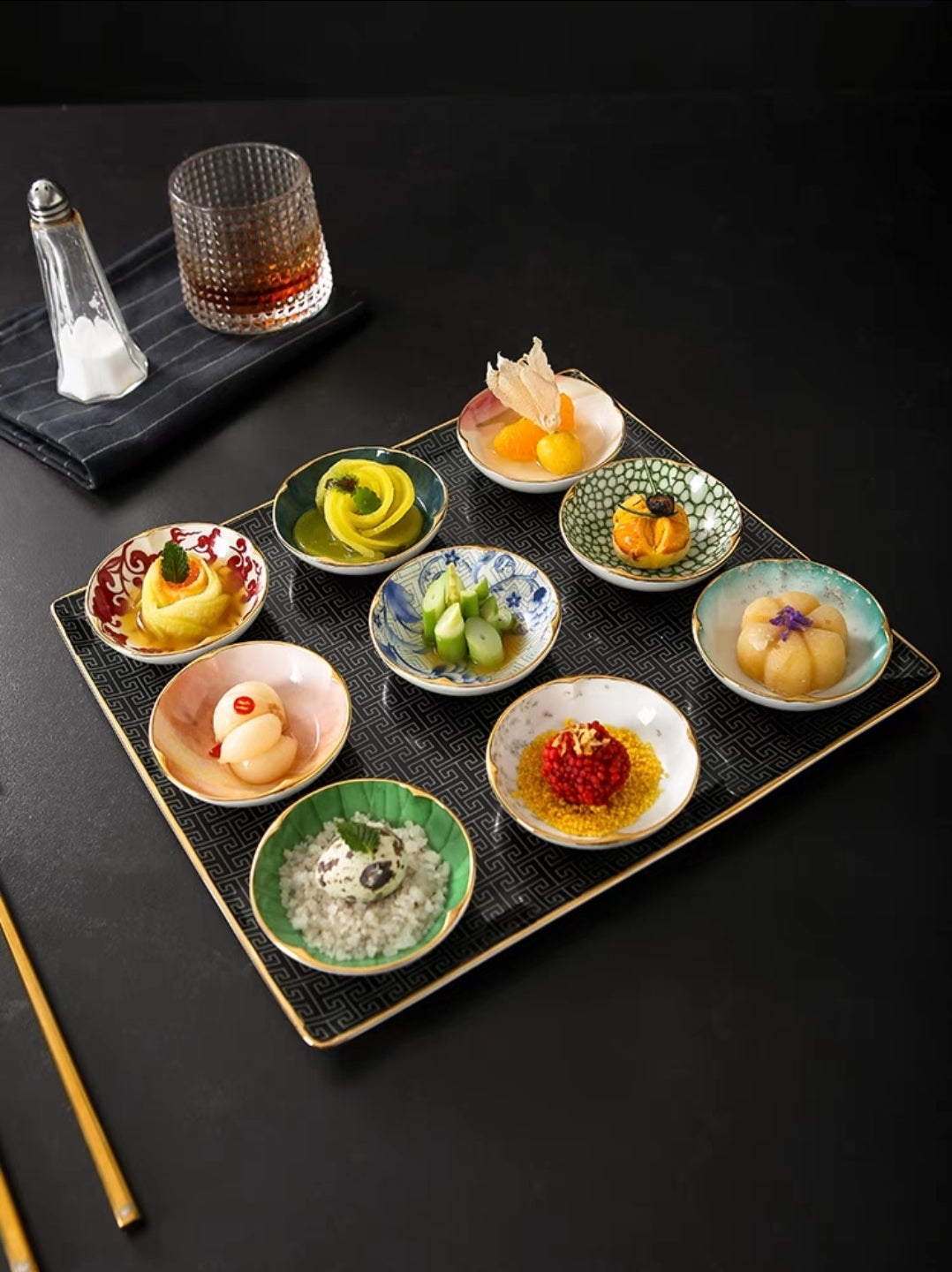 9-piece Chinese appetizer plate set with ceramic dipping bowls and textured tray for sushi and desserts.