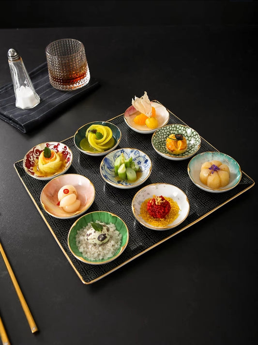 9-piece Chinese appetizer plate set with ceramic dipping bowls and textured tray for sushi and desserts.