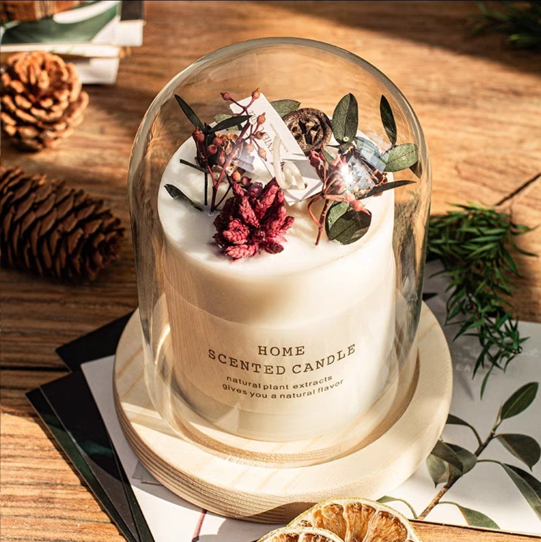 Home scented candle with decorative elements on a wooden surface