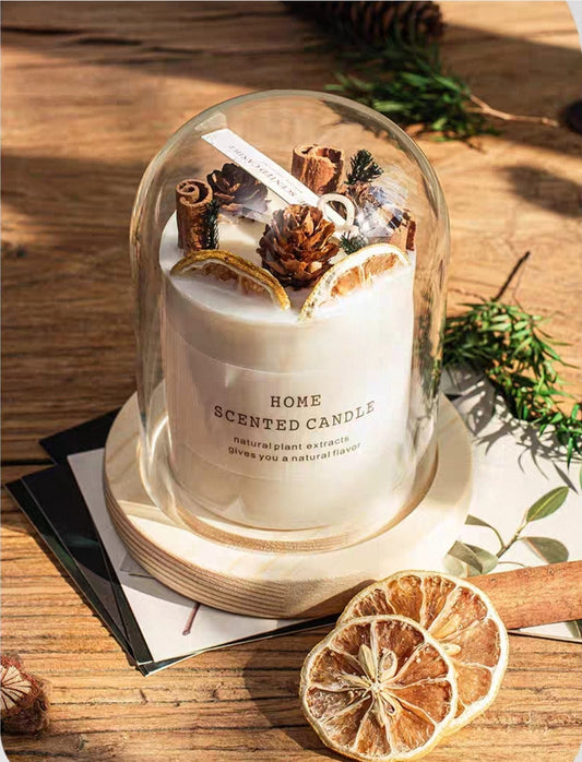 Home dried flower scented candle with decorative elements on a wooden surface