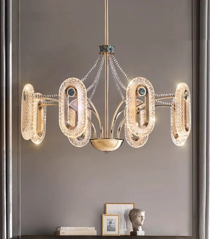 Luxury ceiling chandelier installed in an upscale living room interior.