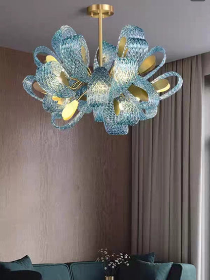 Brushed brass 12-head modern chandelier with frosted crystal shades and tri-color LED lighting for living room or dining space


