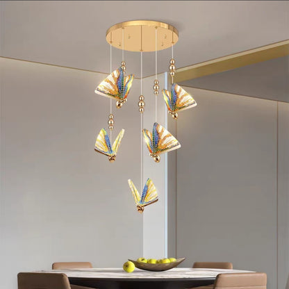 Gold frame chandelier with abalone shells styled in minimalist living space.