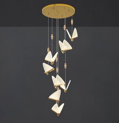 Modern chandelier with butterfly-shaped lights on a dark background