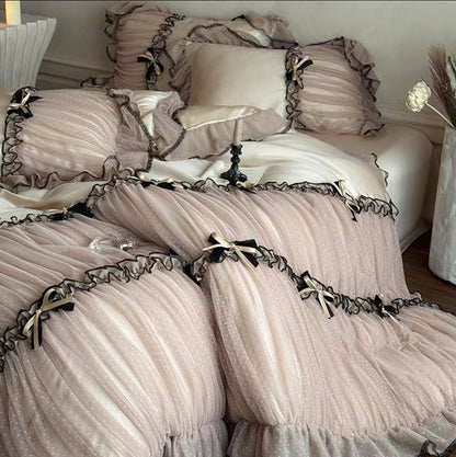 French princess-style Tencel silk bedding with ruffled lace trim and satin bows.
