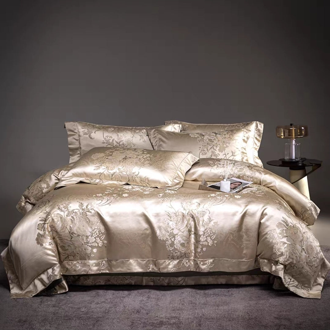 Gold satin bedding set on a bed with a dark background