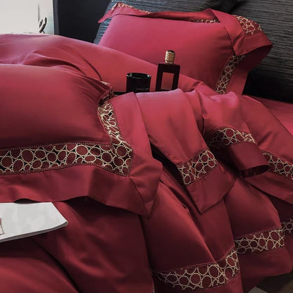 Red 100S cotton bedding set on bed with embroidered duvet cover and pillows
