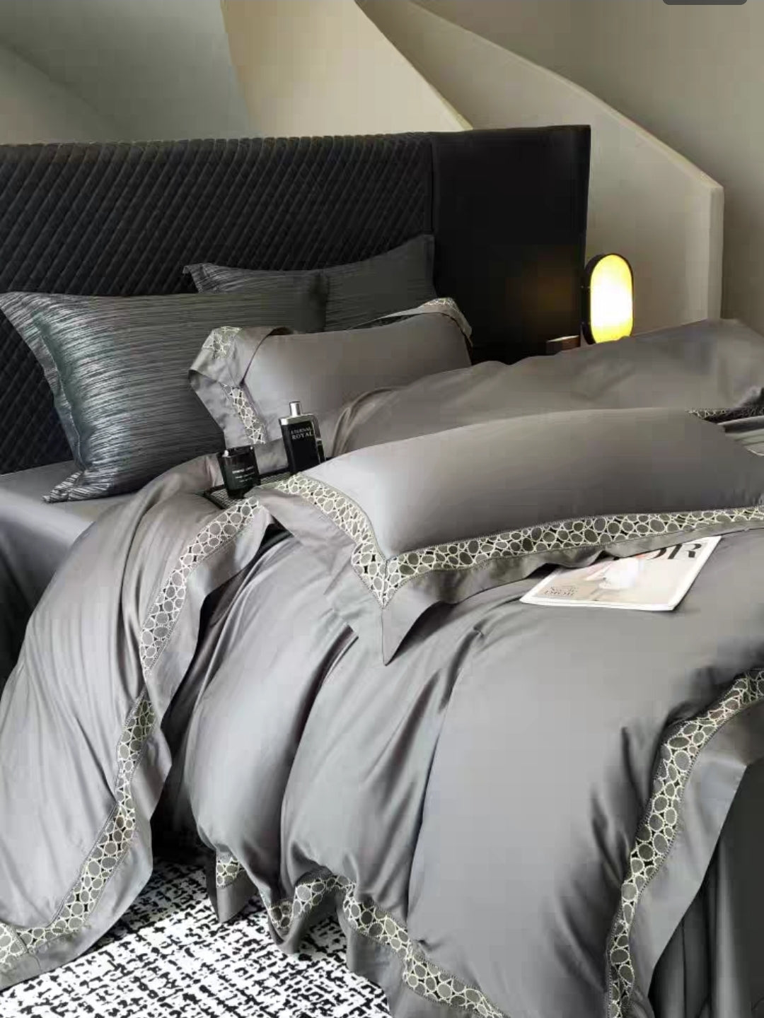 Deep grey 100S cotton bedding set on bed with matching sheets and pillows