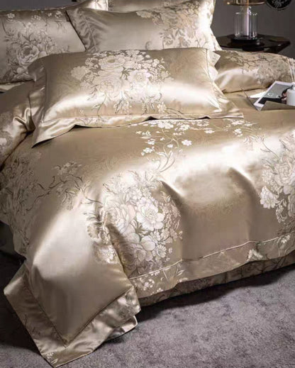 
Close-up of satin weave pillowcase and duvet cover in elegant floral detailing.