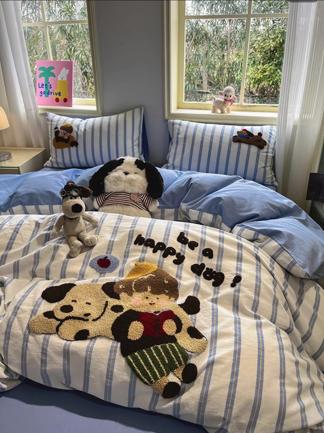 Children's cotton cartoon bedding set  with blue and white striped bedding featuring cartoon dog designs.