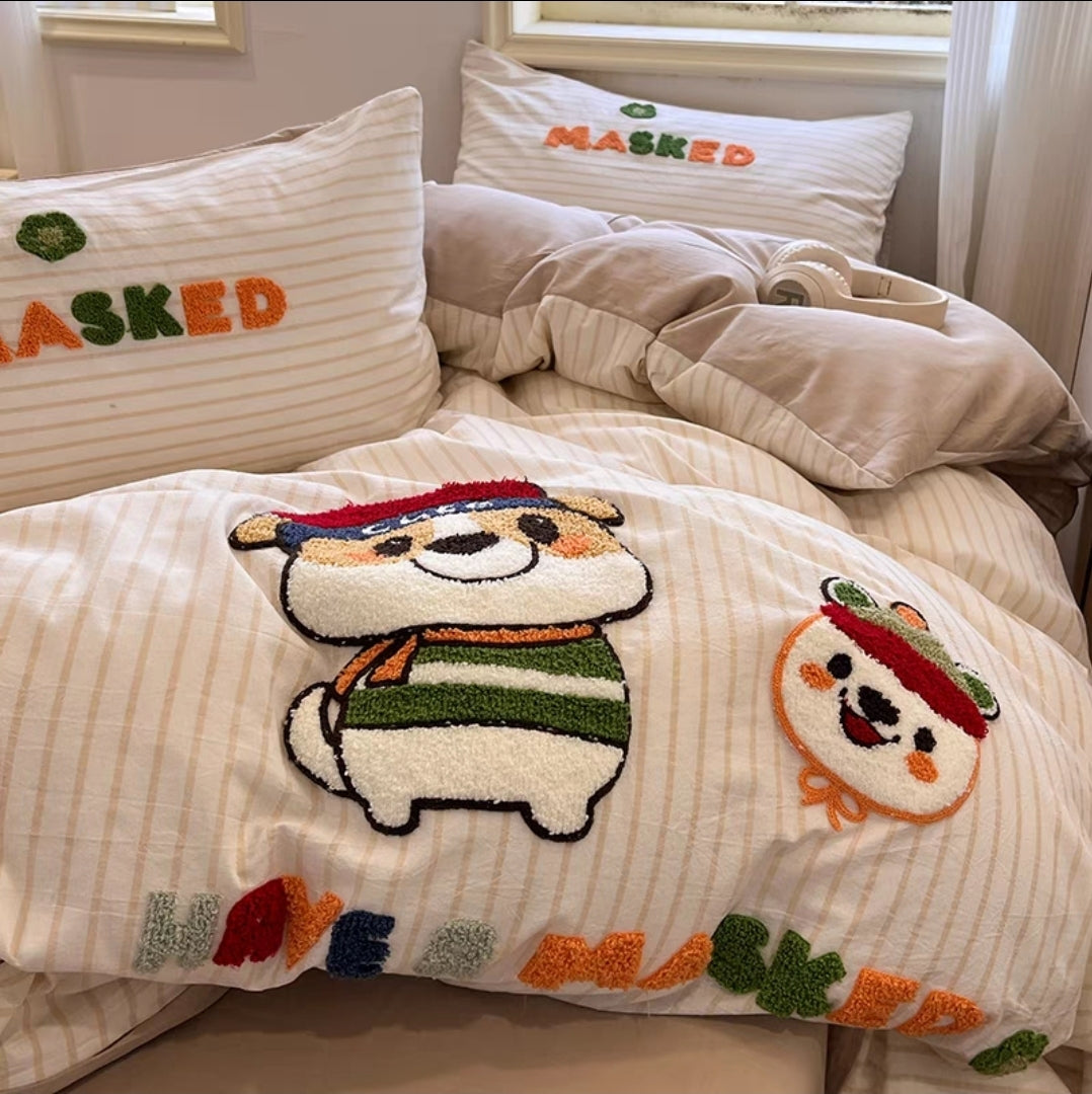 Bedding set with cartoon character design and 'MASKED' text on pillows