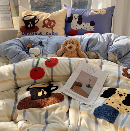 Children's bedding set with cartoon designs on a bed