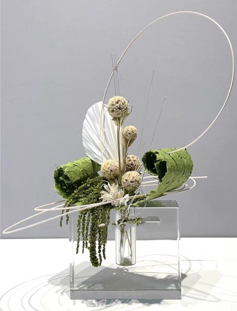 Modern faux floral sculpture with gold arc frame and test-tube vase for minimalist interior design


