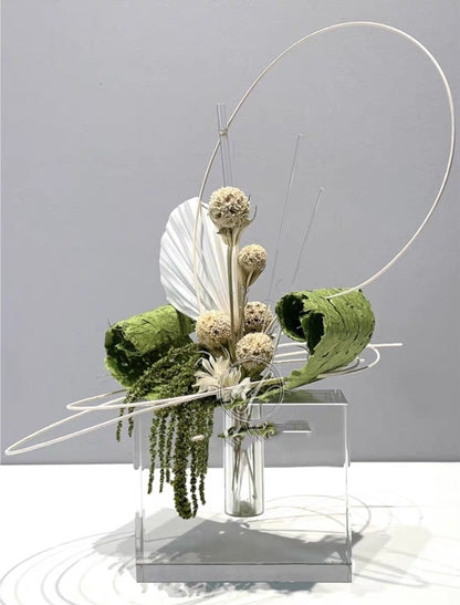 Modern faux floral sculpture with gold arc frame and test-tube vase for minimalist interior design

