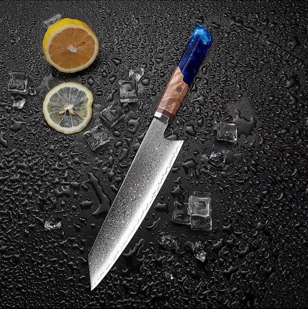 Blue resin wood handle chef knife displayed with citrus slices and ice cubes
