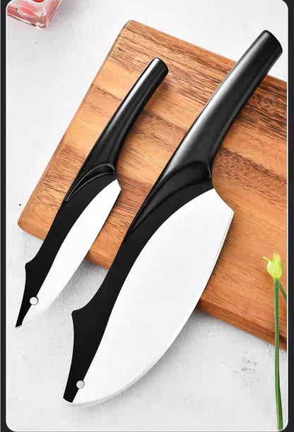 Minimalist black knife set arranged diagonally on a white surface
