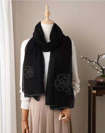 Black camellia embroidered silk-wool shawl with delicate beaded trim.

