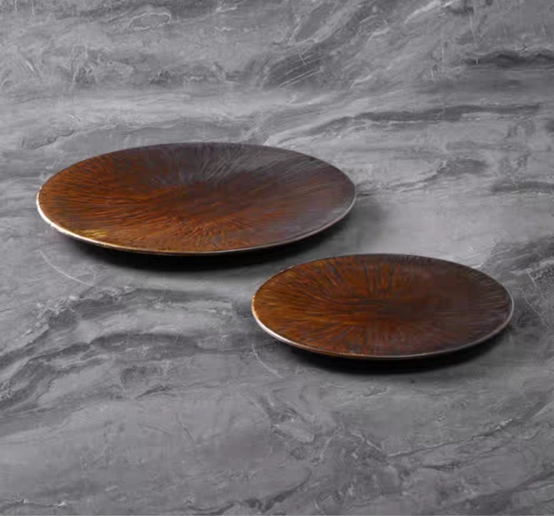 Chinese-style ceramic flat plate with glossy glaze and textured surface, styled with chopsticks 