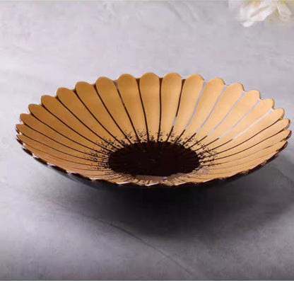 Overhead shot of Japanese floral design ceramic plate with delicate petal-edge finish