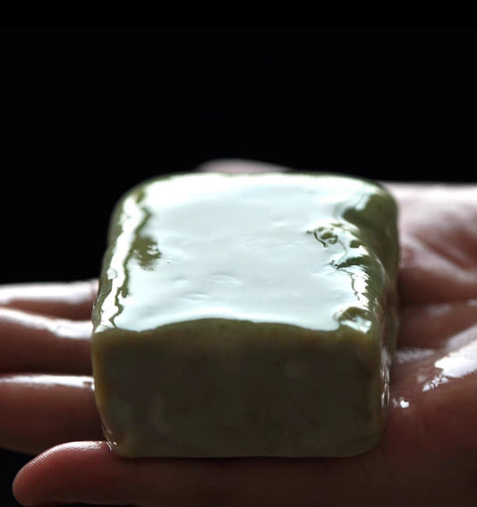 Handmade avocado milk soap bar, cold process soap bar on palm with silky lather, perfect for sensitive and dry skin.

