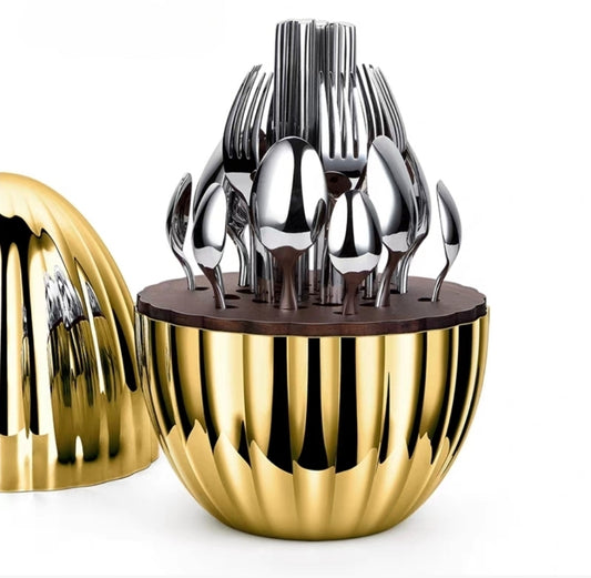 Luxury 24-piece silver cutlery set with sculptural egg-shaped holder by Verlin Studio – Elegant dining utensil organizer.
